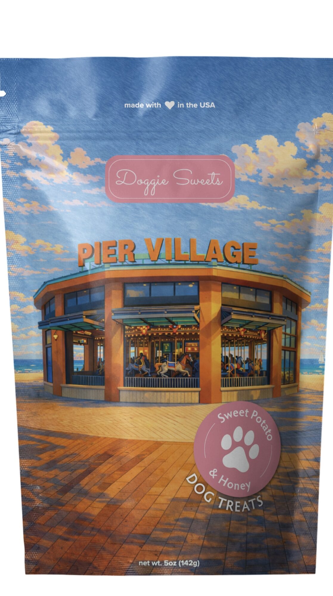 Pier Village building with blue sky and clouds, brick walkway in foreground, and a pink label with paw print.