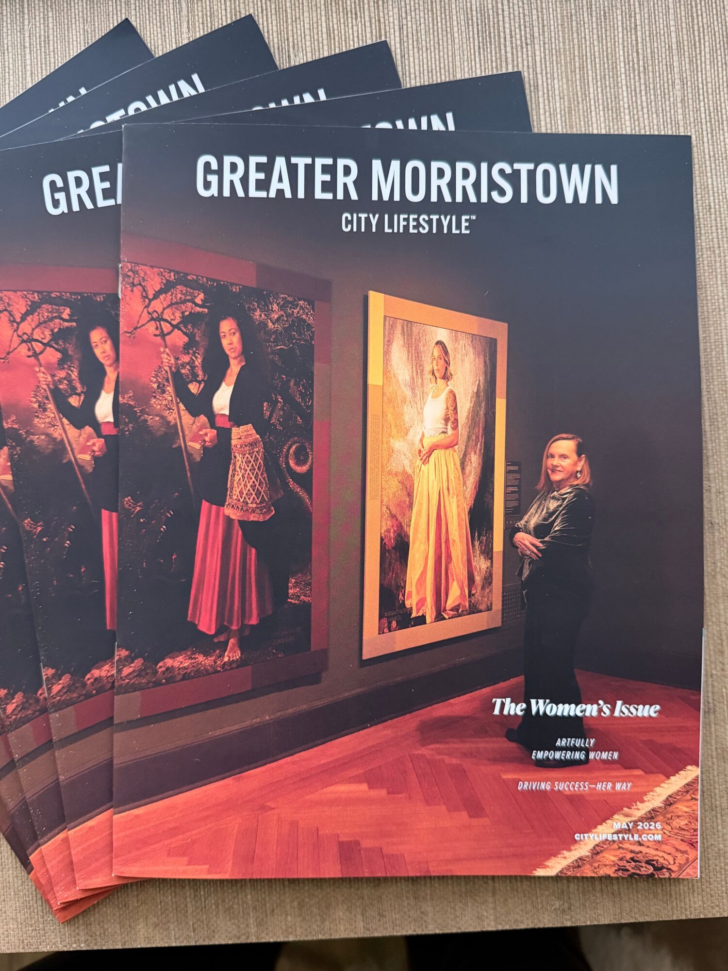 Brochure titled 'Greater Morristown' with a woman in a black dress and a painting in a gallery.