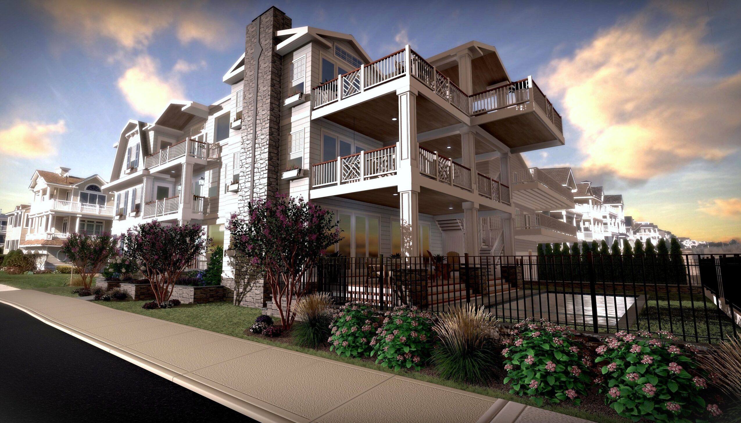 Multi-story residential building with balconies, surrounded by a fence and landscaped bushes, under a partly cloudy sky.