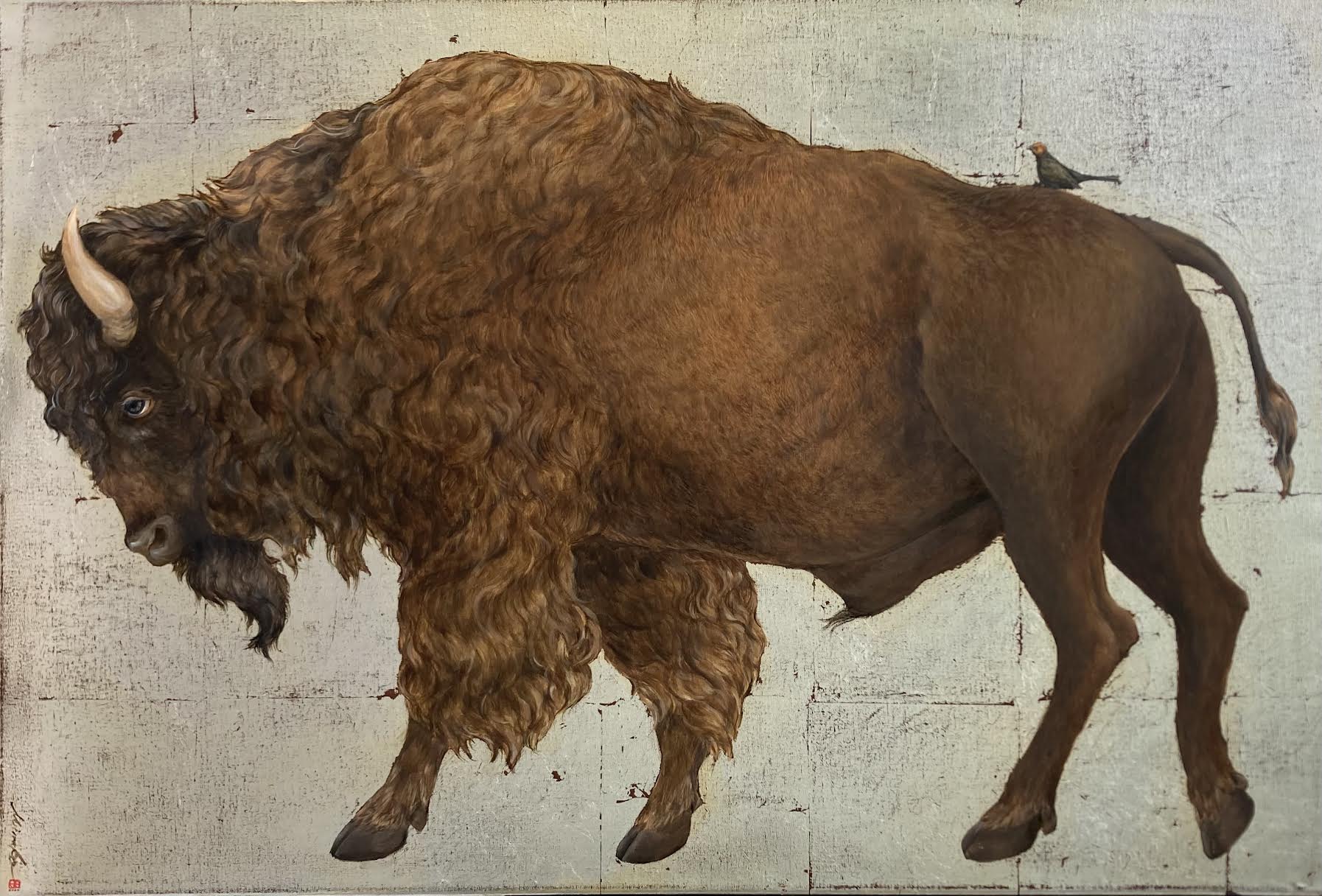A hybrid creature with the body of a bison and the head of a lion, standing against a plain background.