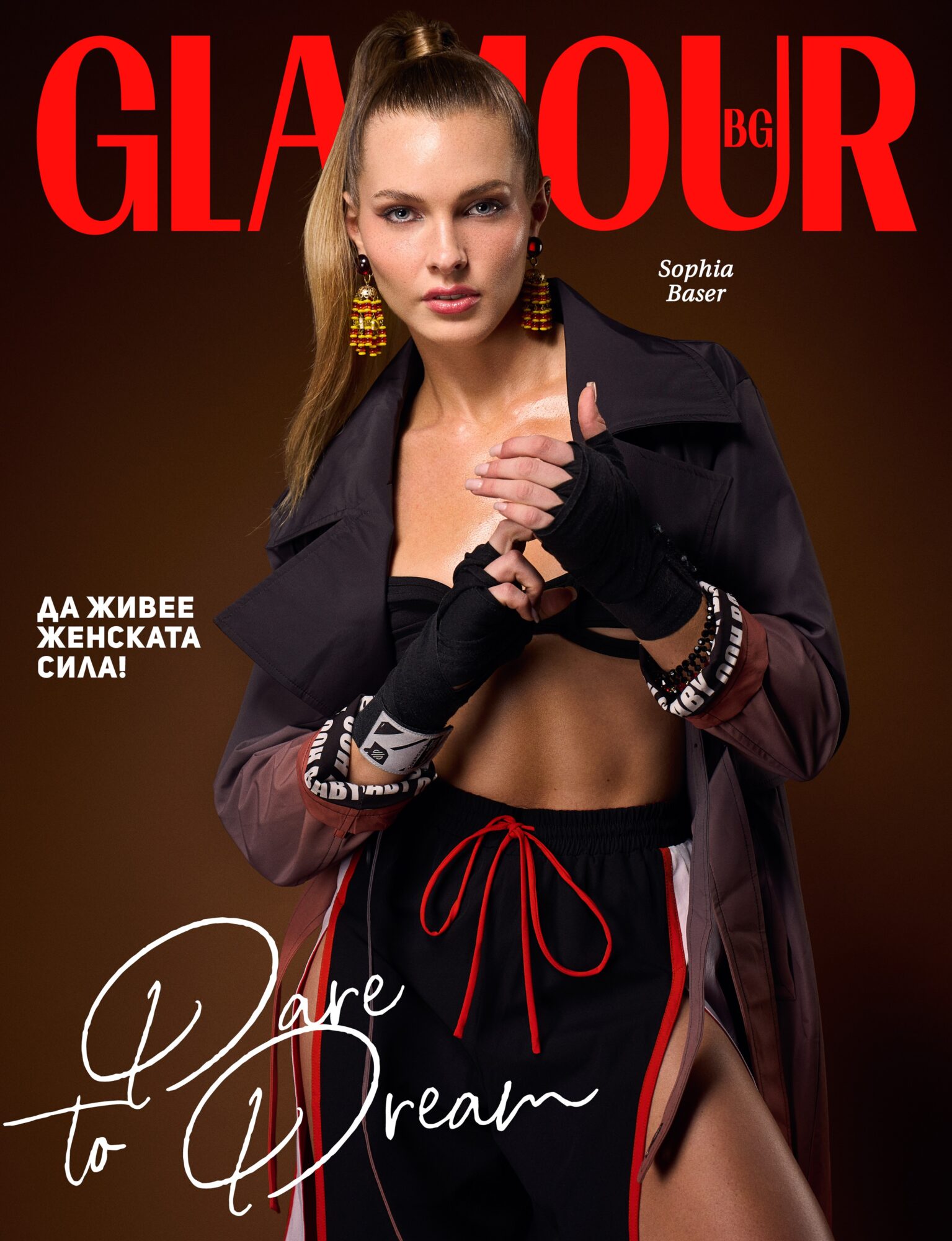 Woman in athletic wear and jacket on magazine cover, holding her jacket, with text and logo in background.