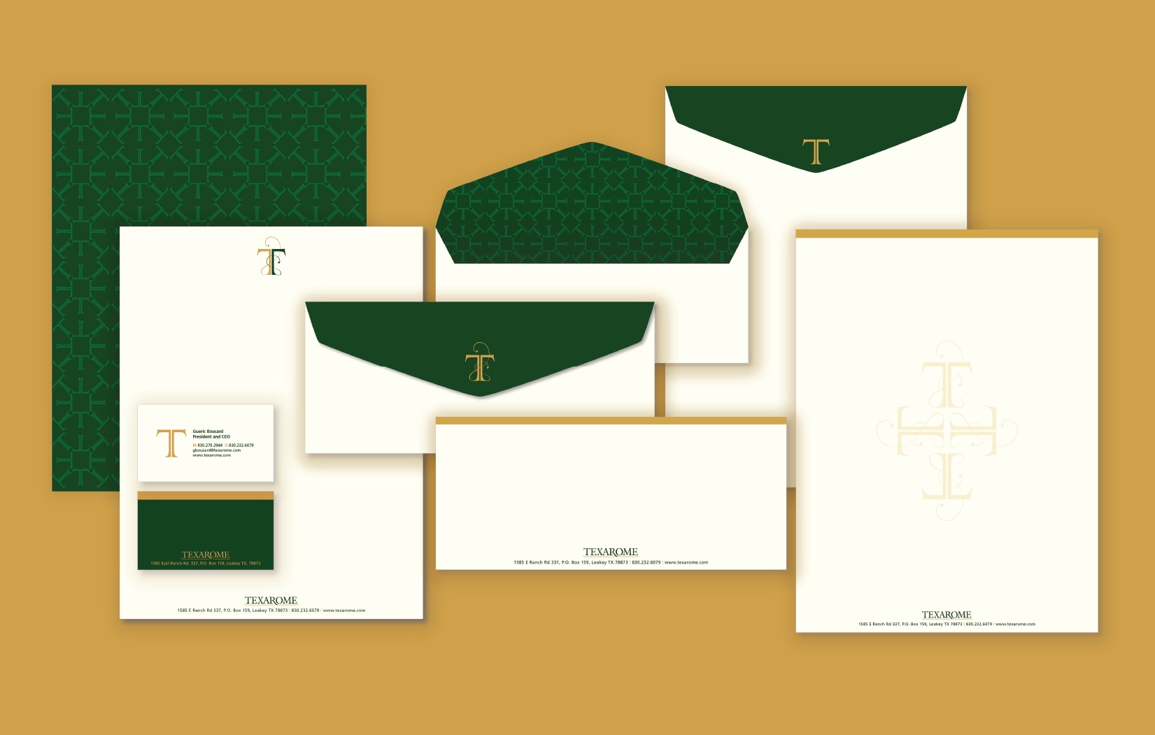 Collection of stationery including folders, envelopes, and a notepad with green and white design, on a tan background.