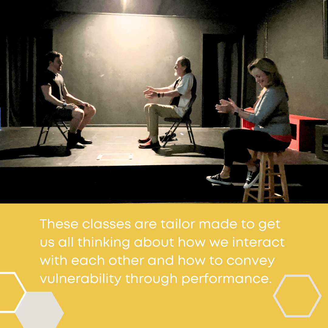 Three people sit on chairs and a stool on a stage, engaging in conversation and clapping, with a yellow text box below.
