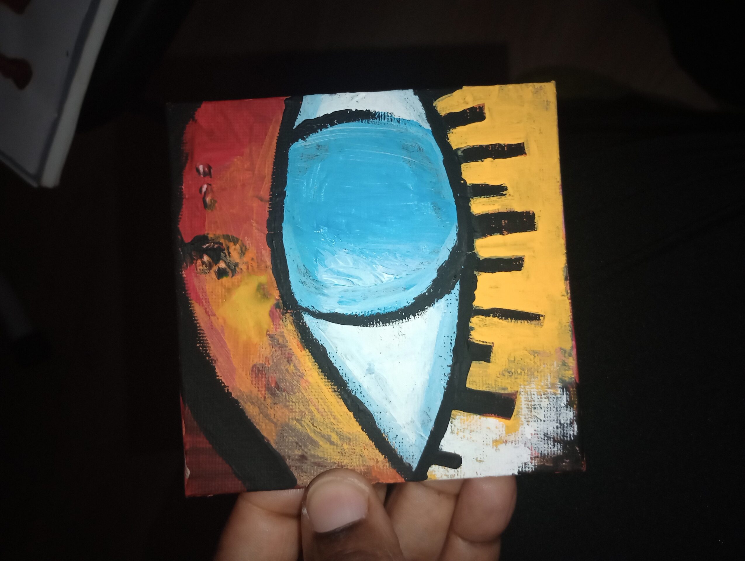 Abstract painting with a blue shape, black lines, and yellow and red background elements.