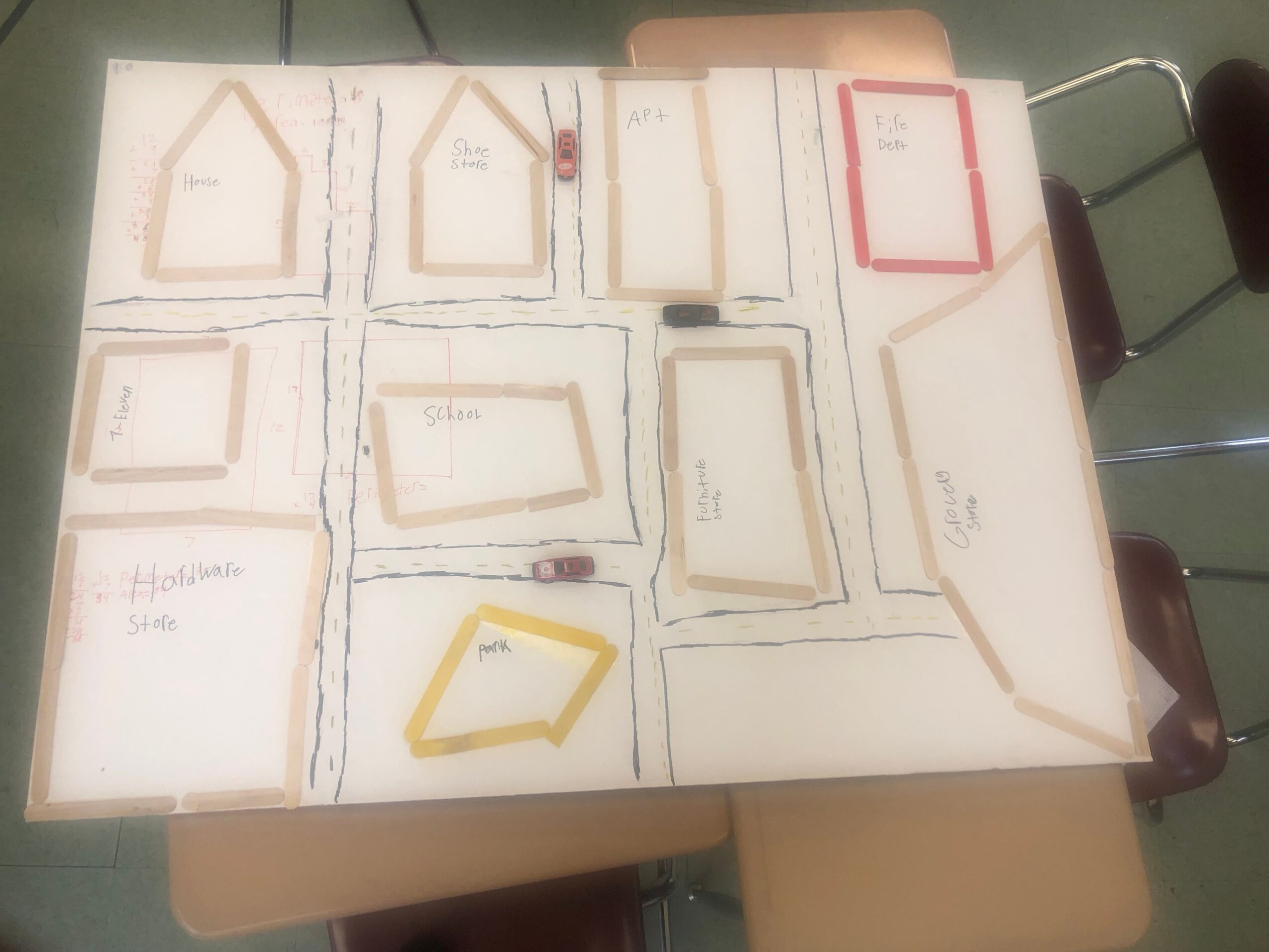 Hand-drawn floor plan on a large sheet, with labeled rooms, doors, and colored outlines.