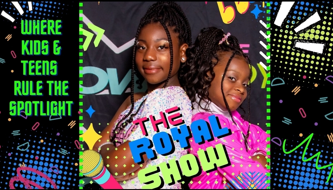 Two people pose behind colorful text reading “The Royal Show,” with a green sign about kids and teens on the left.