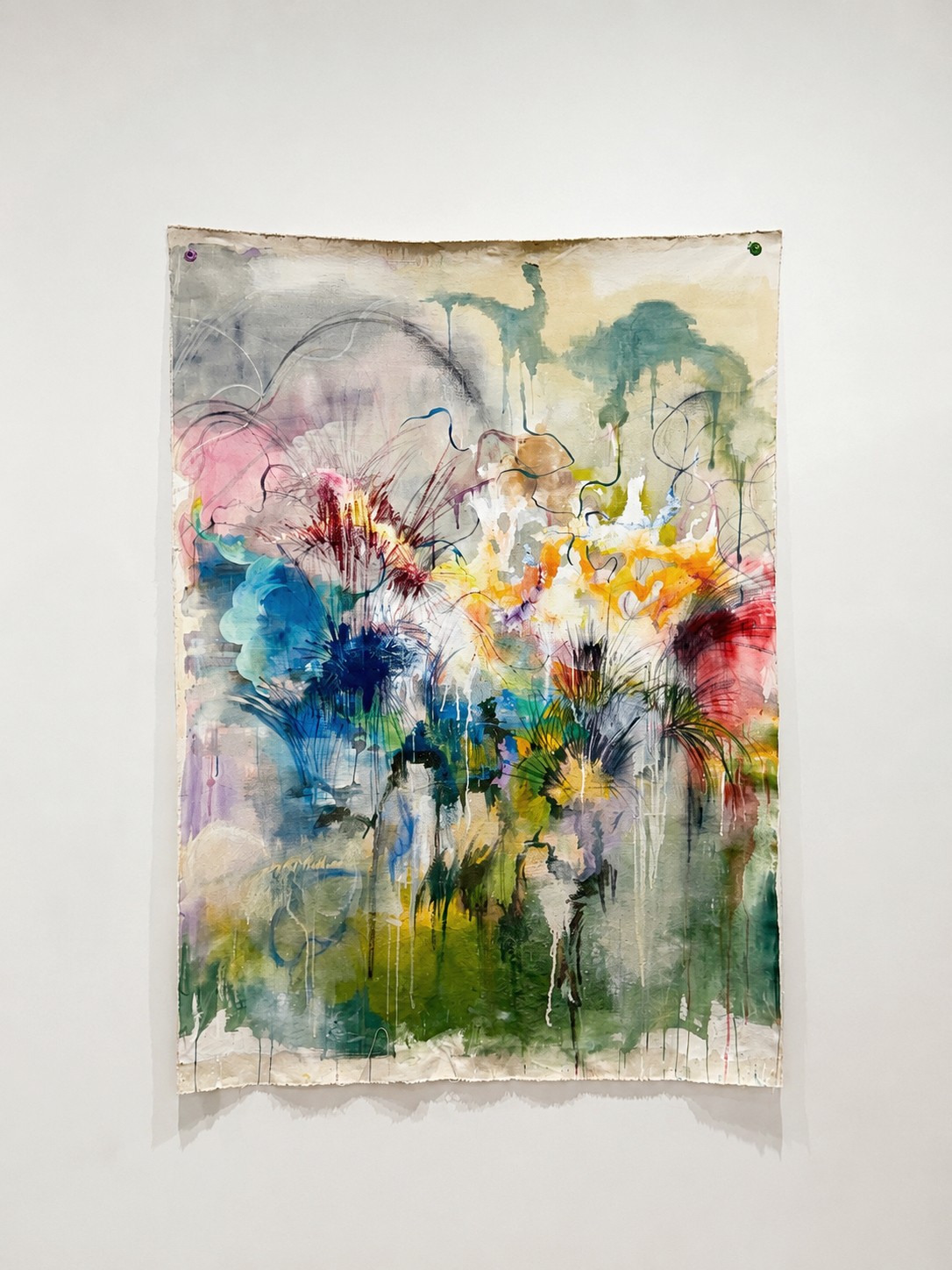 Abstract watercolor painting with layered washes and expressive marks in green, blue, pink, yellow, and orange.